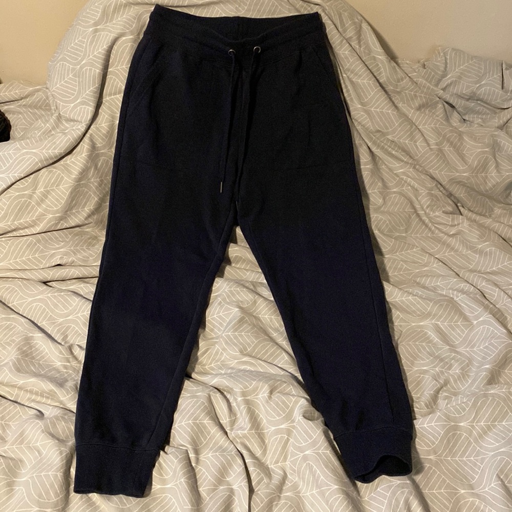 Dark blue tracksuit.
